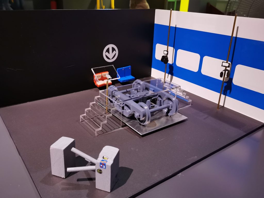 A miniture model of an exhibition room showing the montreal metro bogie.